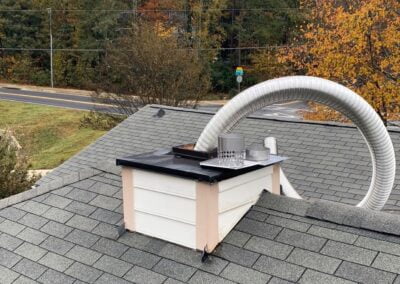 new flue liner sticking out of chimney ready to be installed