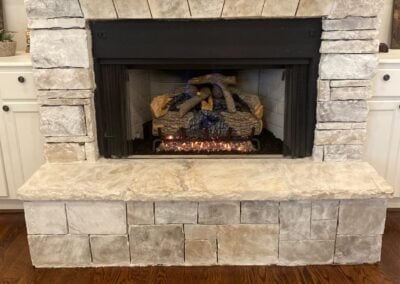 stone fireplace with gas logs