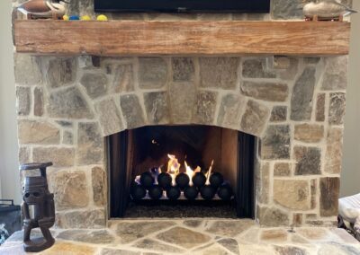 stone gas fireplace with spheres