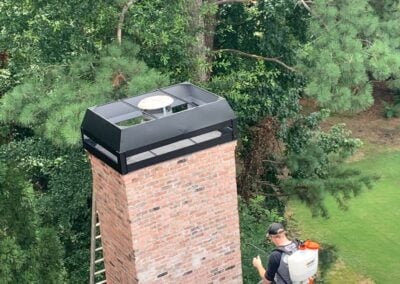 brick chimney with new rain pan and shroud