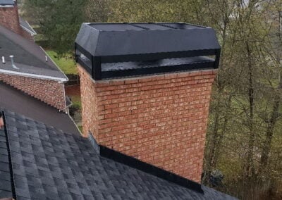 brick chimney with new rain pan and shroud