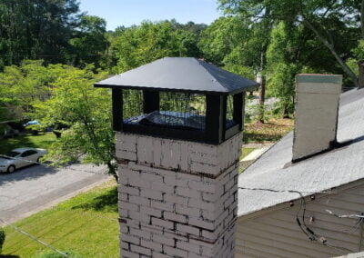painted white chimney with new cap