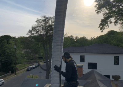 relining a chimney with a flexible metal liner