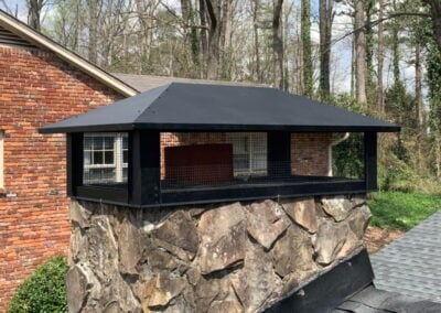 stone chimney with new chimney cap